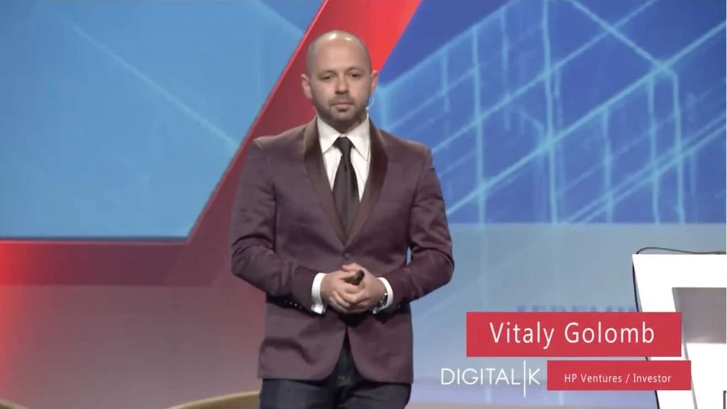 Vitaly presenting with a headset microphone at Digital K